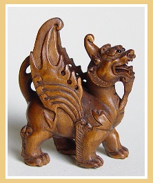 PALMHOUTEN NETSUKE&nbsp;KIRIN MET VLEUGELS.&nbsp;JAPAN.