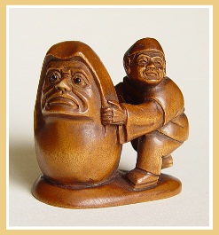 PALMHOUTEN NETSUKE MAN MET DARUMA. JAPAN.