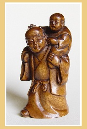 PALMHOUTEN NETSUKE VADER EN KIND. JAPAN.